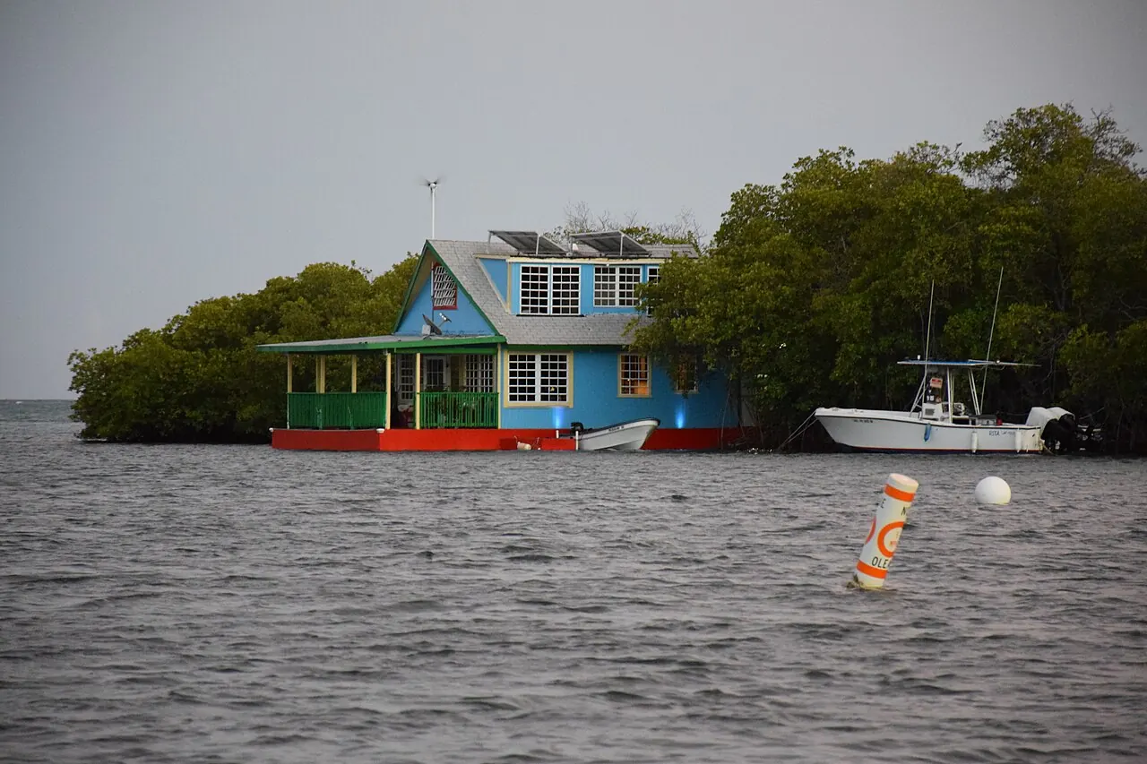 A stilt house and boat on the water at La Parguera